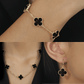 Conjunto com Trevos Pretos Dourados