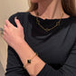 Conjunto com Trevos Pretos Dourados