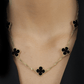 Conjunto com Trevos Pretos Dourados